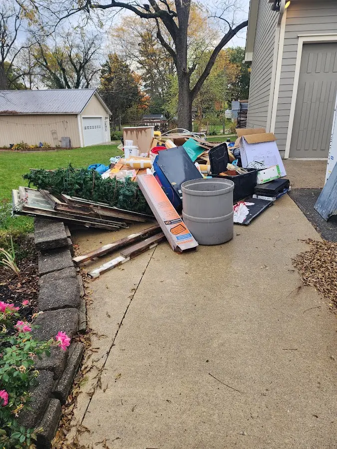 Dumpster being loaded with debris for Commercial Dumpster Rental in Gunnison